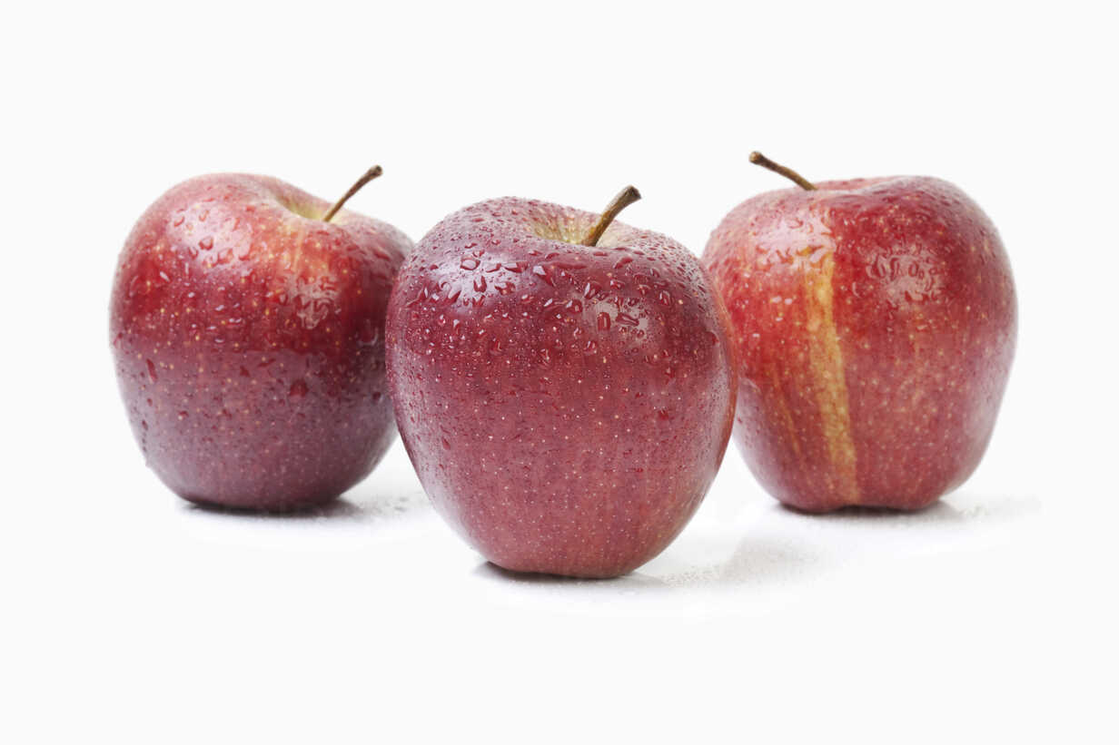 Three Red Apples On White Background Stockphoto