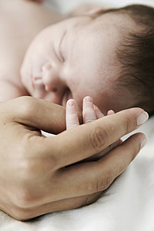 holding newborn to sleep