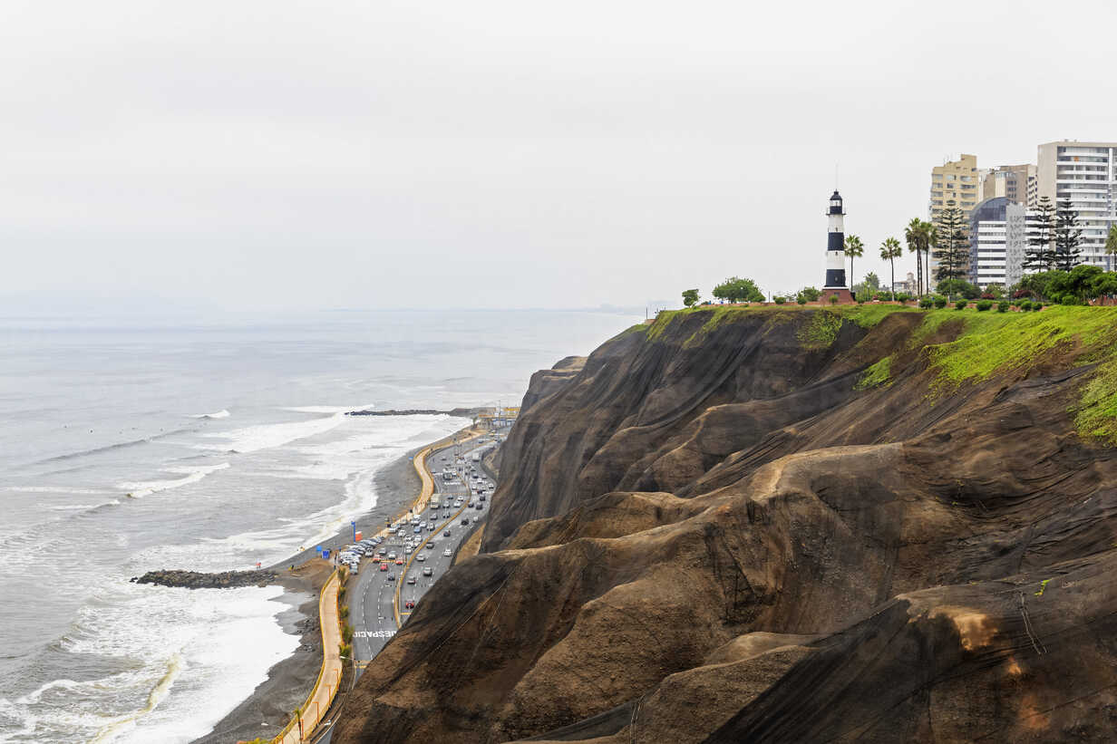 Peru Lima Miraflores Steep Coast Lighthouse And Buildings Stockphoto