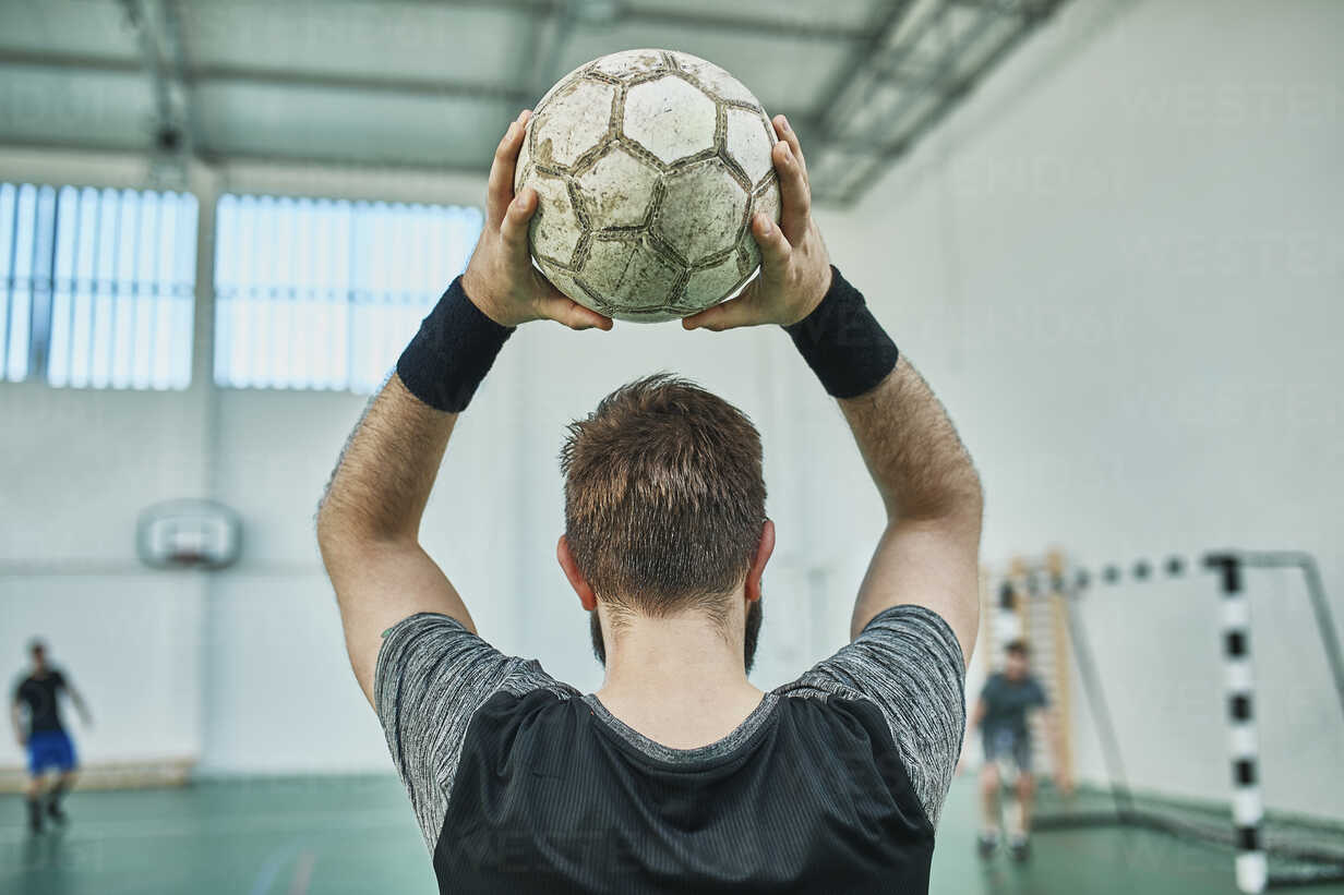Close Up Of Indoor Soccer Player Throwing In The Ball Stockphoto