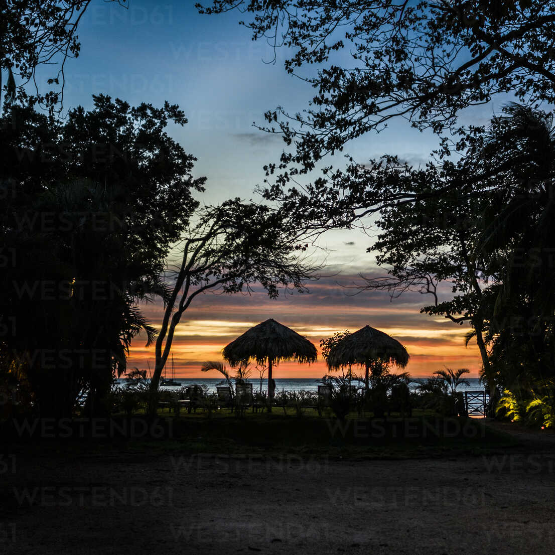 Silhouetted Beach Umbrella S At Sunset Tamarindo Beach Guanacaste Costa Rica Isf Rosanna U Westend61