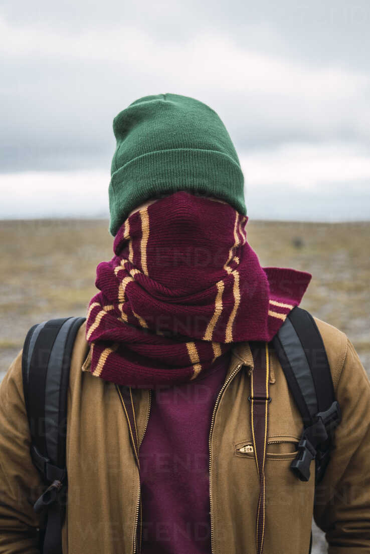 Young Man With Woolly Hat And Scarf Wrapped Around Face Stockphoto