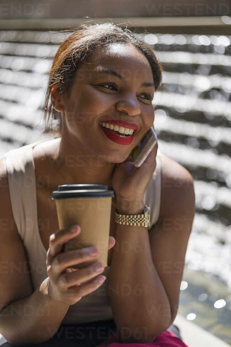 Portrait Of Happy Woman With Coffee To Go On The Phone London Uk Mauf Mauro Grigollo