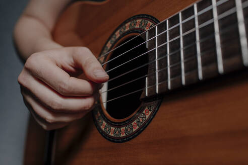 Woman S Hand Playing Guitar Close Up Stockphoto