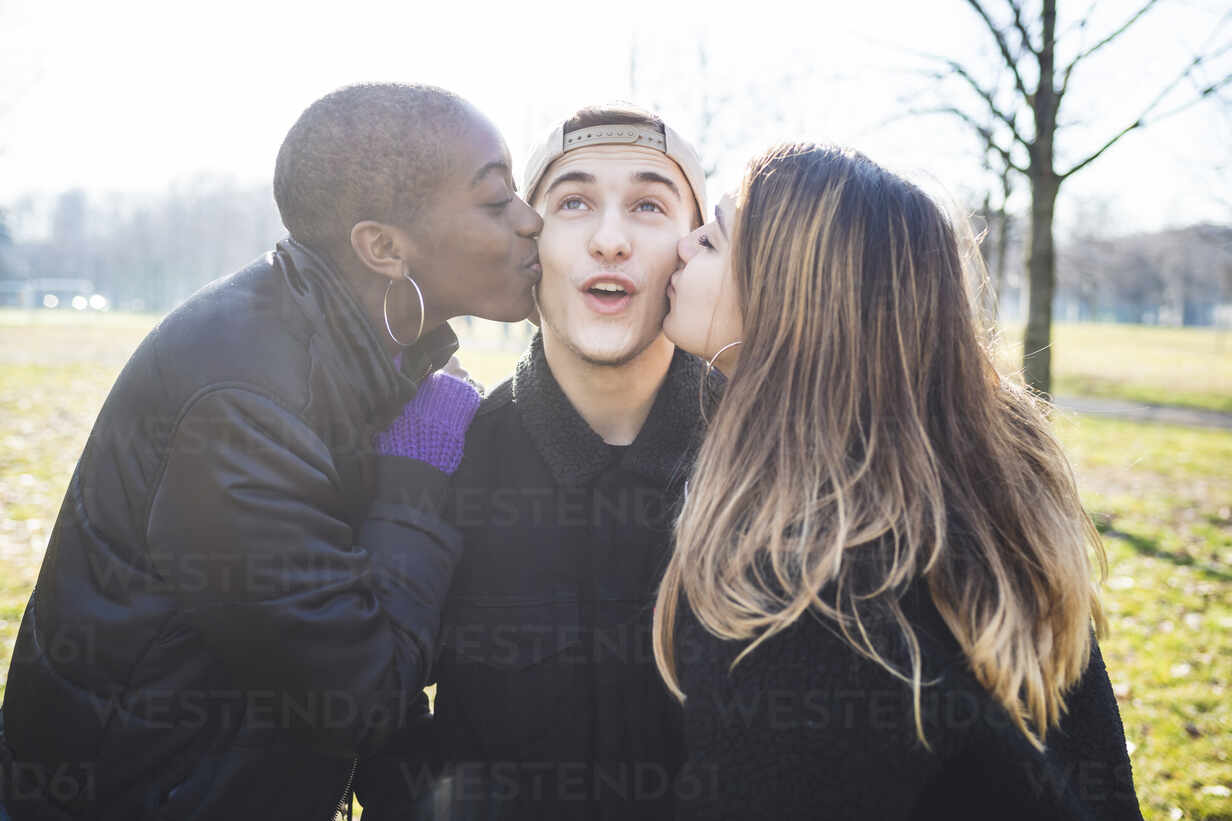 Two Girls Kissing Their Friend On His Cheaks Meuf Eugenio Marongiu Westend61