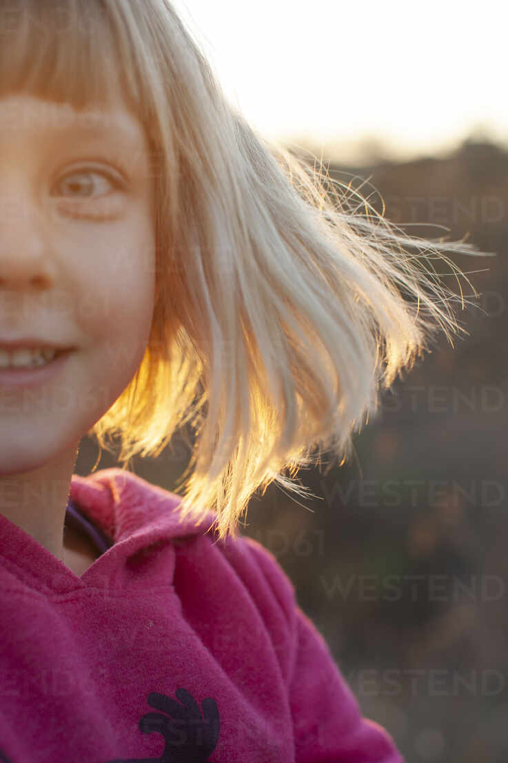 Young Girl With Blonde Hair In Golden Light Stockphoto