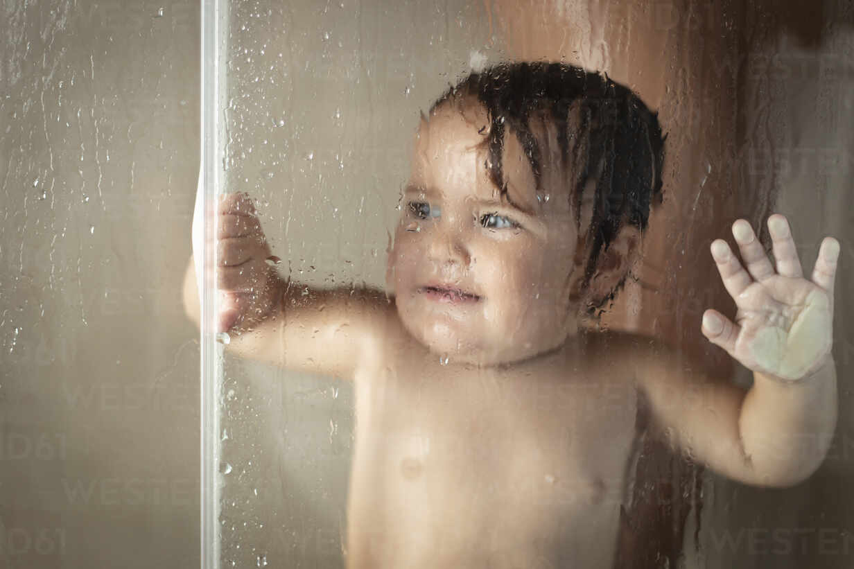 Cheerful Mother With Baby Taking Shower Stockphoto