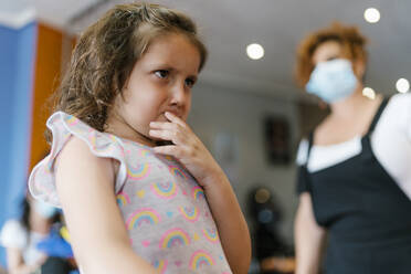 Upset Girl Looking Away T Hairdresser In Hair Salon During Pandemic Stockphoto