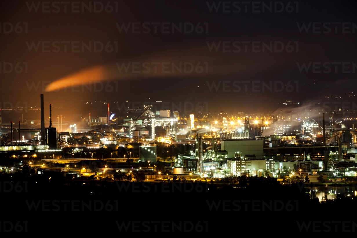 Drone View Of Picturesque Cityscape Of Urban Buildings Illuminated By Bright Lights During Night Time Stockphoto