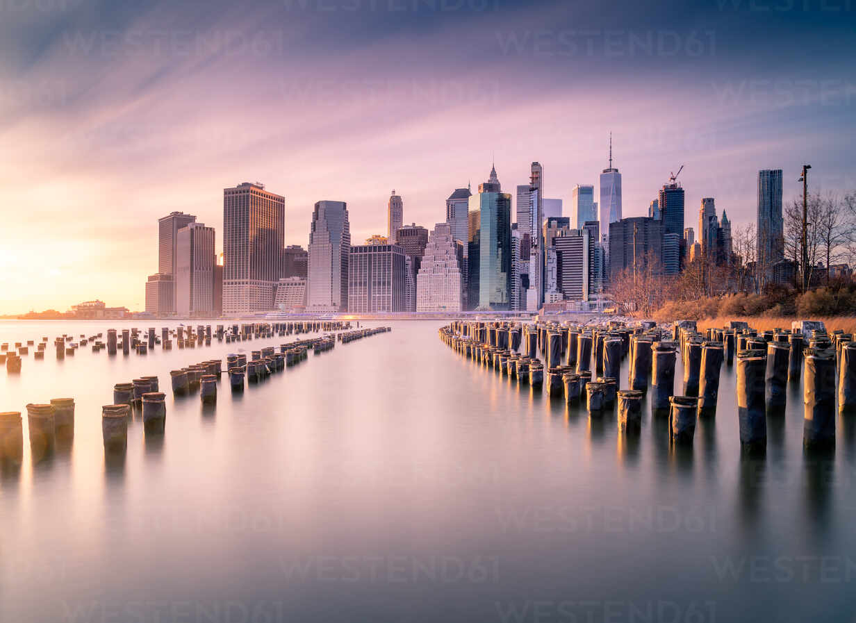 Manhattan Skyline And Poles Of Famous Brooklyn Bridge Park At Sunset Time Adsf Addictive Stock Creatives