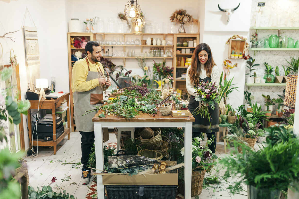 Man And Woman Working While Standing At Flower Shop Mrrf Manu Reyes Westend61