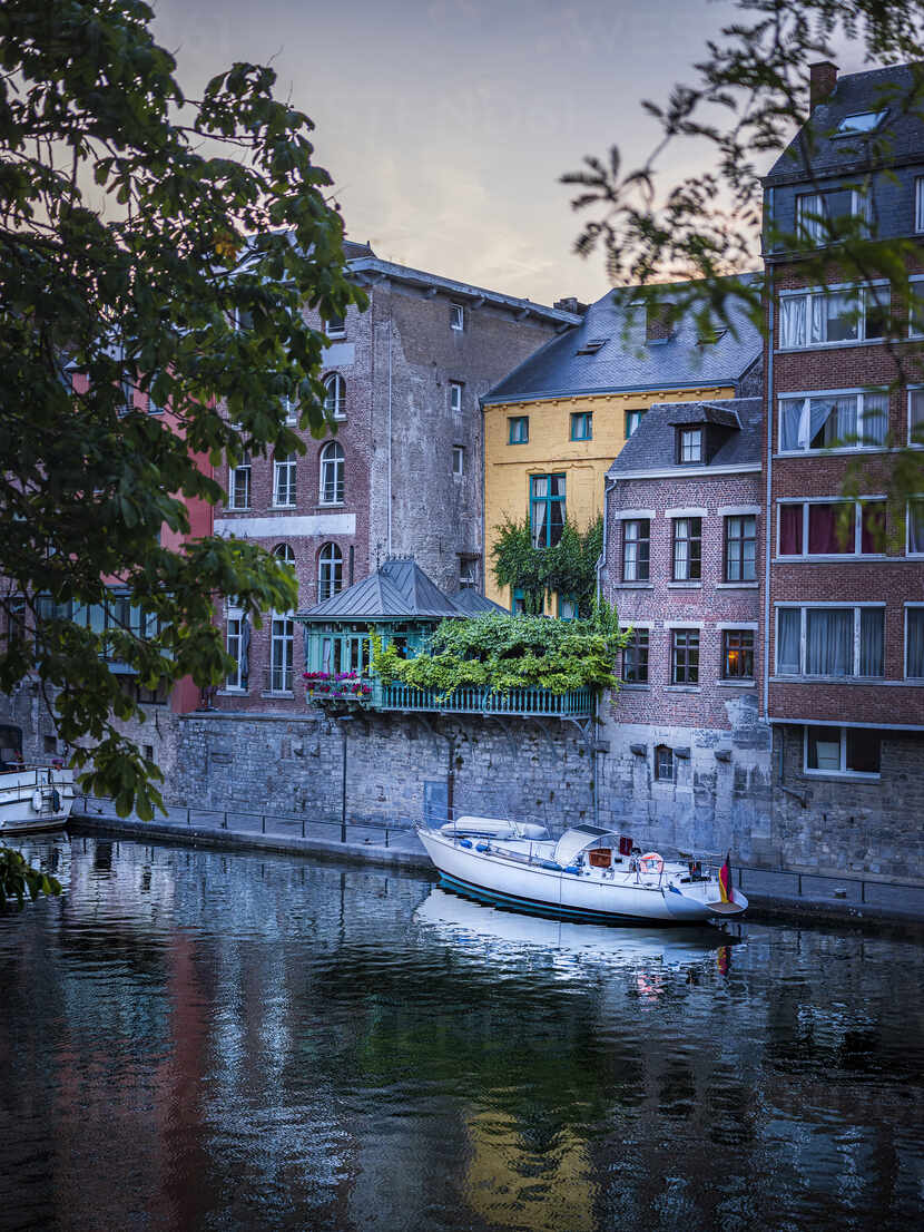 Belgium Namur Province Namur Motorboat Moored Along City Canal Stretching In Front Of Row Of Townhouses