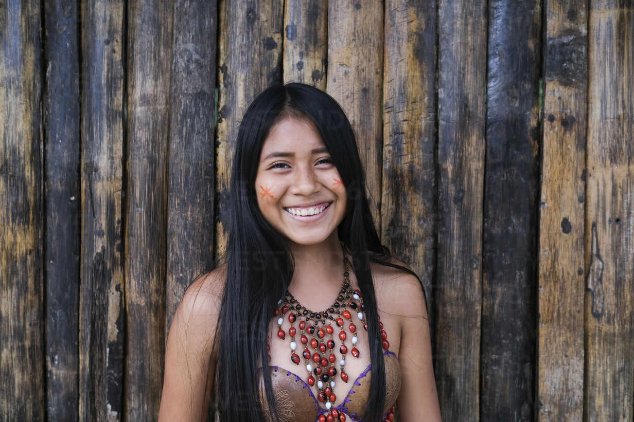 Happy Young Guarani Woman Against Bamboo Wall Misahualli Ecuador Stockphoto