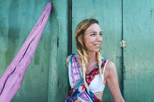 Smiling Beautiful Woman Day Dreaming While Standing In Doorway Of Shack Stockphoto