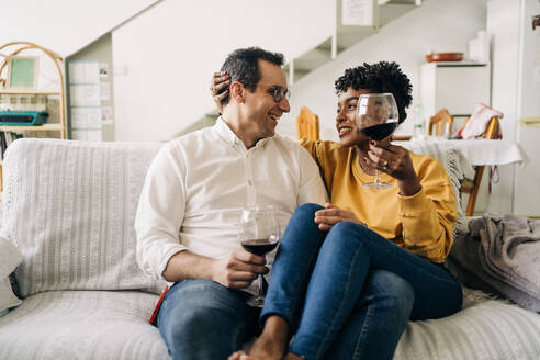 Content Multiracial Couple Chilling On, Take Red Wine Out Of Sofa